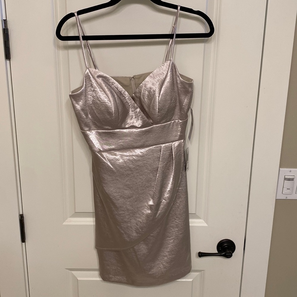 Teeze Me brand sold at Macy’s. Size 9/10. Bust has pads for cleavage.